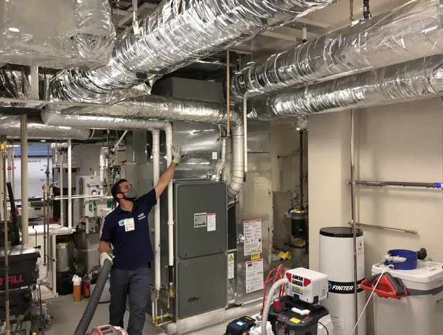 Lincoln Air Duct Cleaning specialist performing thorough furnace duct cleaning in a Lincoln residence