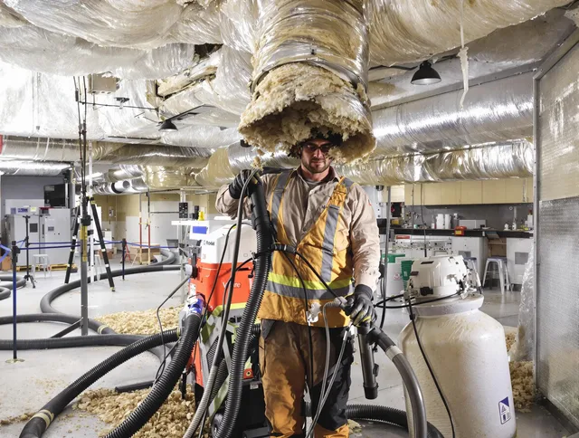 Professional vacuum insulation removal by Lincoln Air Duct Cleaning expert in Lincoln